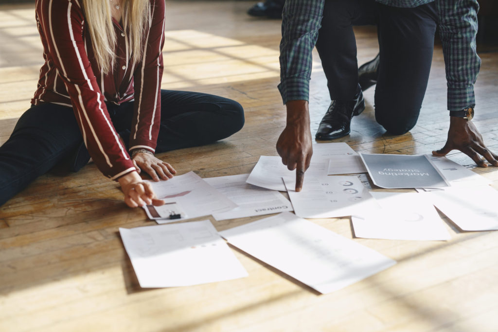 Paperwork On A Wooden Floor Jzyshuz 1024X683 1 - 5 Signs Your Company Needs A Digital Transformation